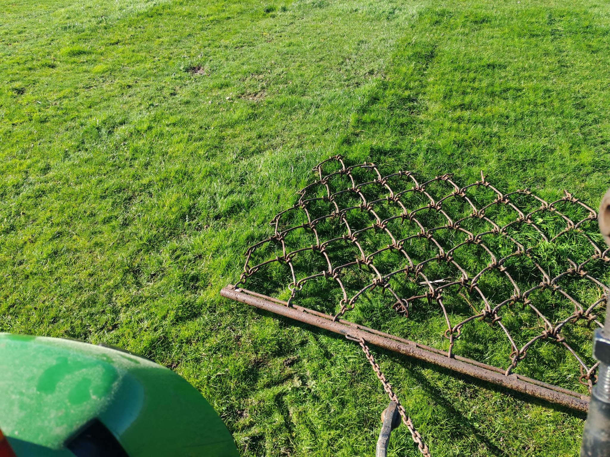 Grass harrowing during paddock maintenance in Lincolnshire